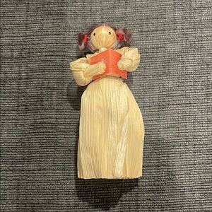 Vintage Handcrafted Corn Husk Doll with Orange Book